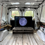 a video screen inside a van featuring experimental films