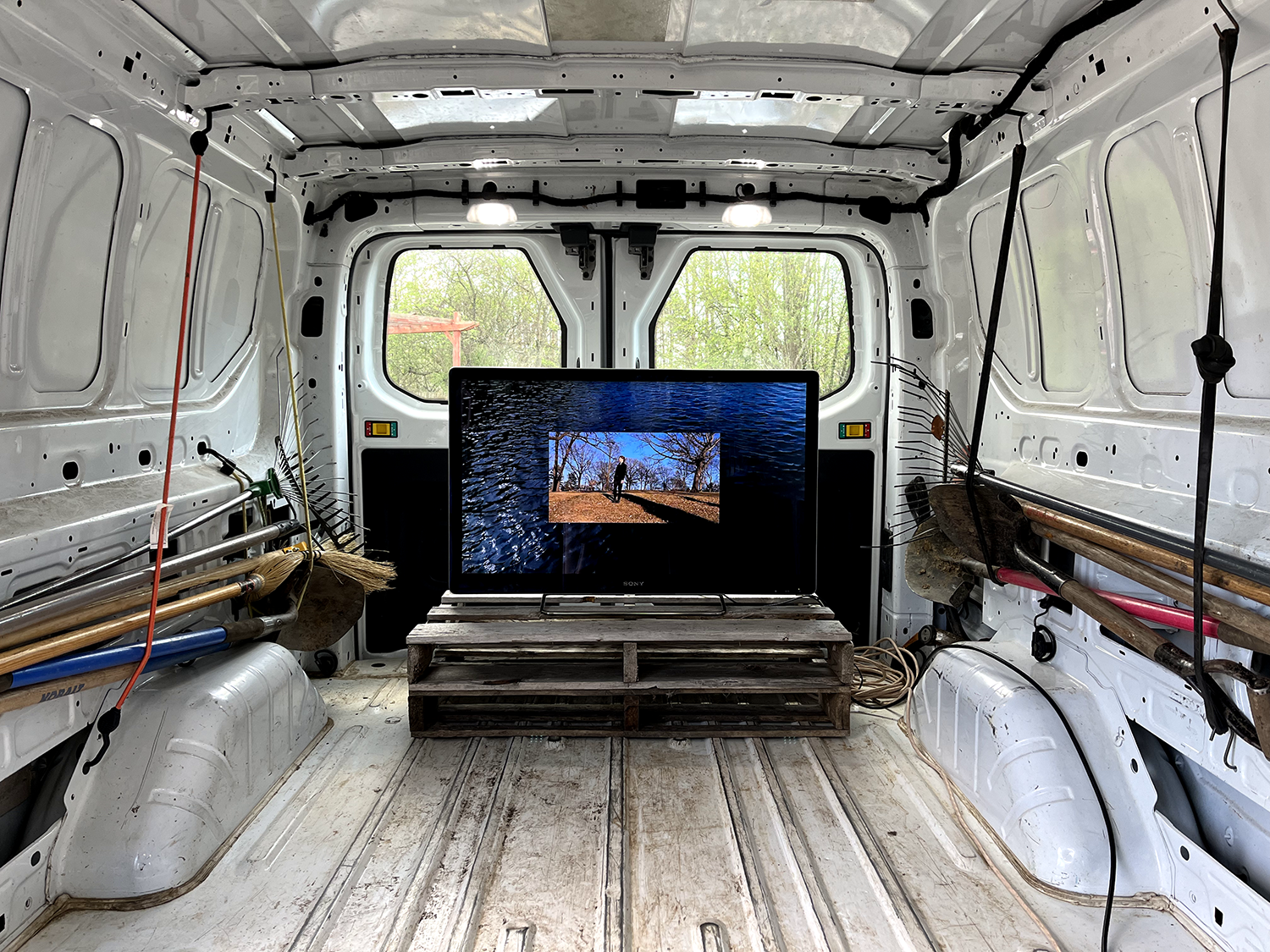 a video screen inside a van featuring experimental films