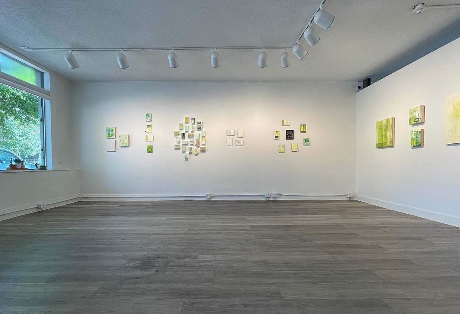 gallery with green artworks