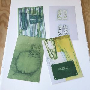 four green white and yellow postcards